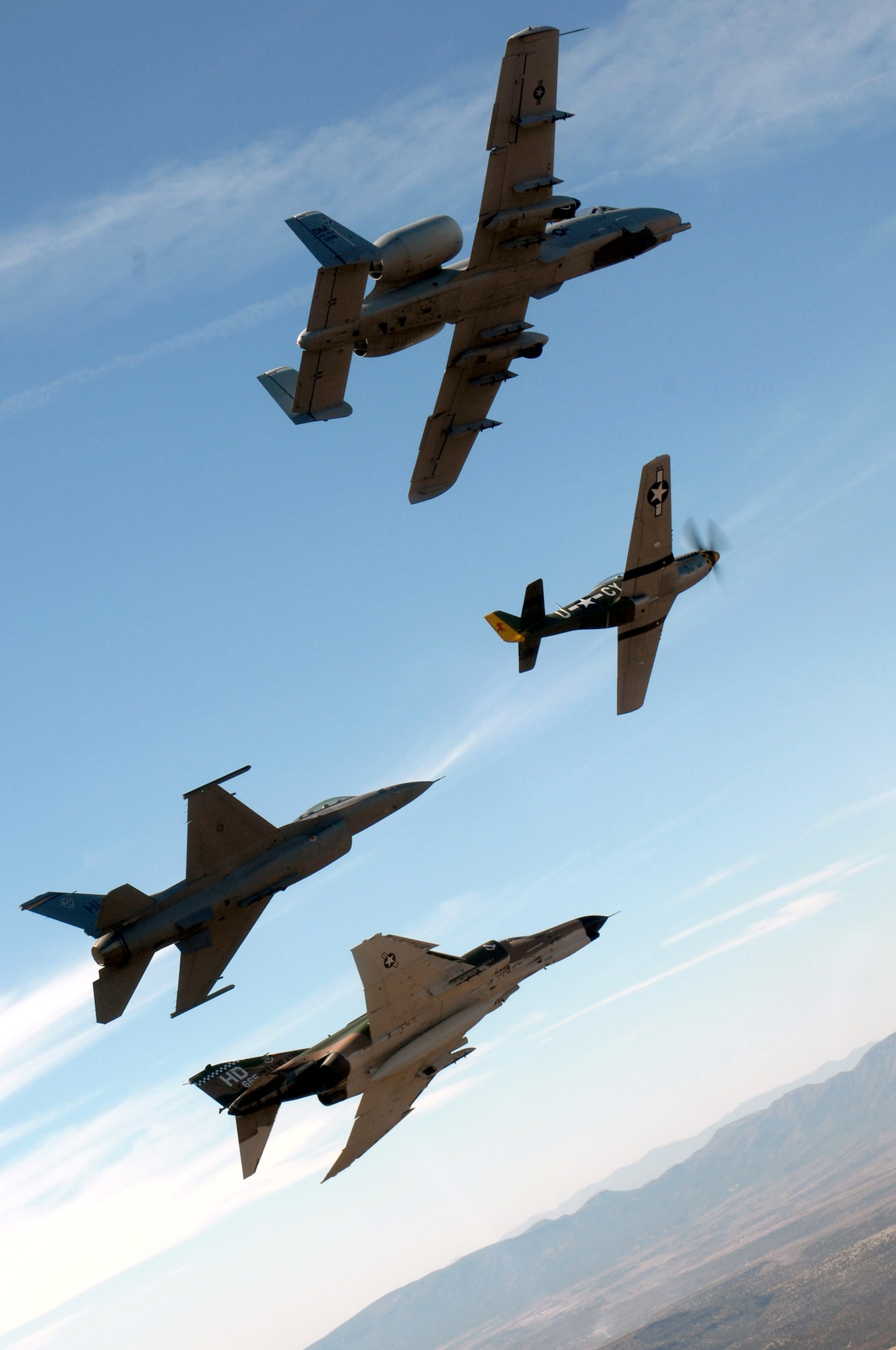An Air Force heritage flight consisting of a P-51 Mustang, an F-4 Phantom, an A-10 Thunderbolt and an F-16 Fighting Falcon fly over the Arizona desert on March 19 above Sadona. The flight was part of the events taking place in Phoenix for the first Air Force Week celebration of the year. (U.S. Air Force photo/Tech. Sgt. Justin D. Pyle) 