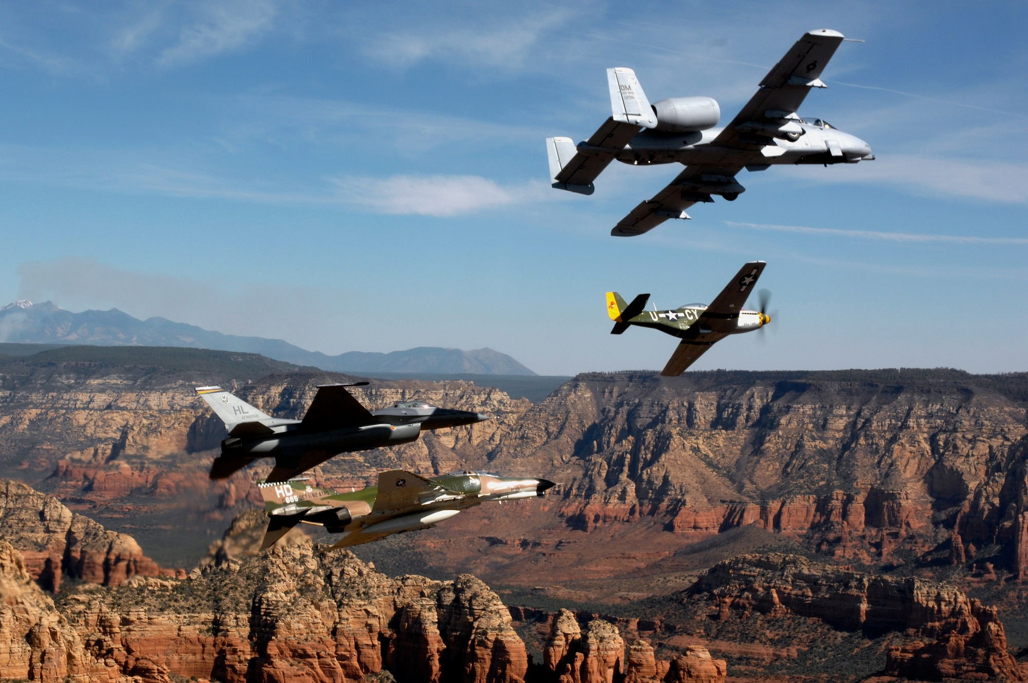 An Air Force heritage flight consisting of a P-51 Mustang, an F-4 Phantom, an A-10 Thunderbolt and an F-16 Fighting Falcon fly over the Arizona desert on March 19 above Sadona. The flight was part of the events taking place in Phoenix for the first Air Force Week celebration of the year. (U.S. Air Force photo/Tech. Sgt. Justin D. Pyle) 