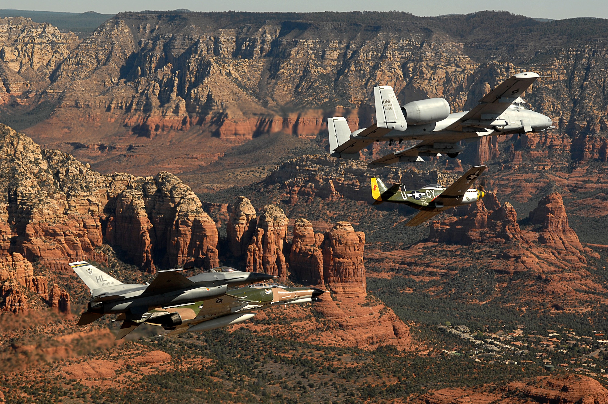 An Air Force heritage flight consisting of a P-51 Mustang, an F-4 Phantom, an A-10 Thunderbolt and an F-16 Fighting Falcon fly over the Arizona desert on March 19 above Sadona. The flight was part of the events taking place in Phoenix for the first Air Force Week celebration of the year. (U.S. Air Force photo/Tech. Sgt. Justin D. Pyle) 