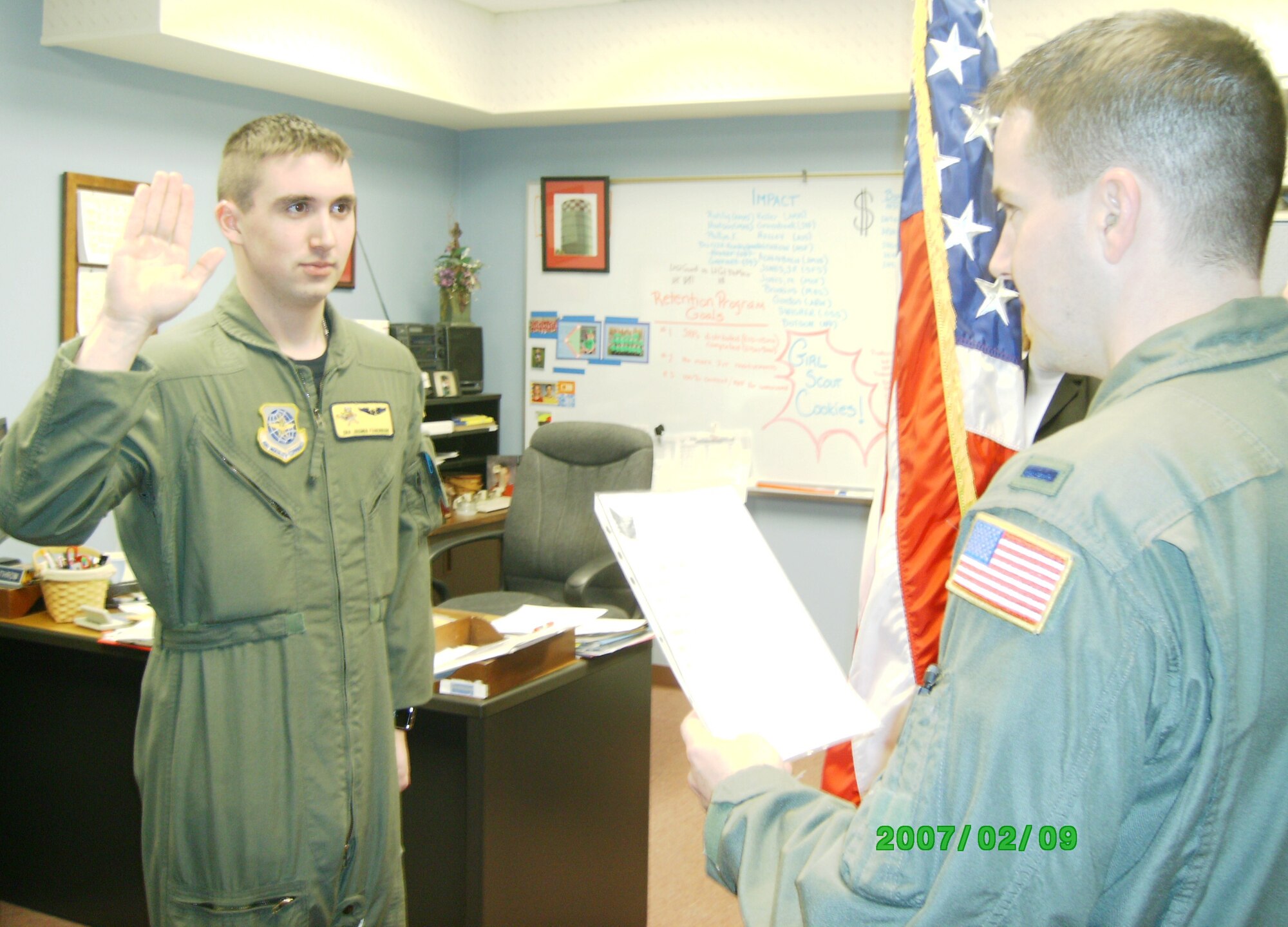 GRISSOM AIR RESERVE BASE, Ind., -- Senior Airman Joshua Fagerburg, left, swears an oath of enlistment as he joins the 434th Air Refueling Wing as a new inflight refueling specialist. (Air Force photo)