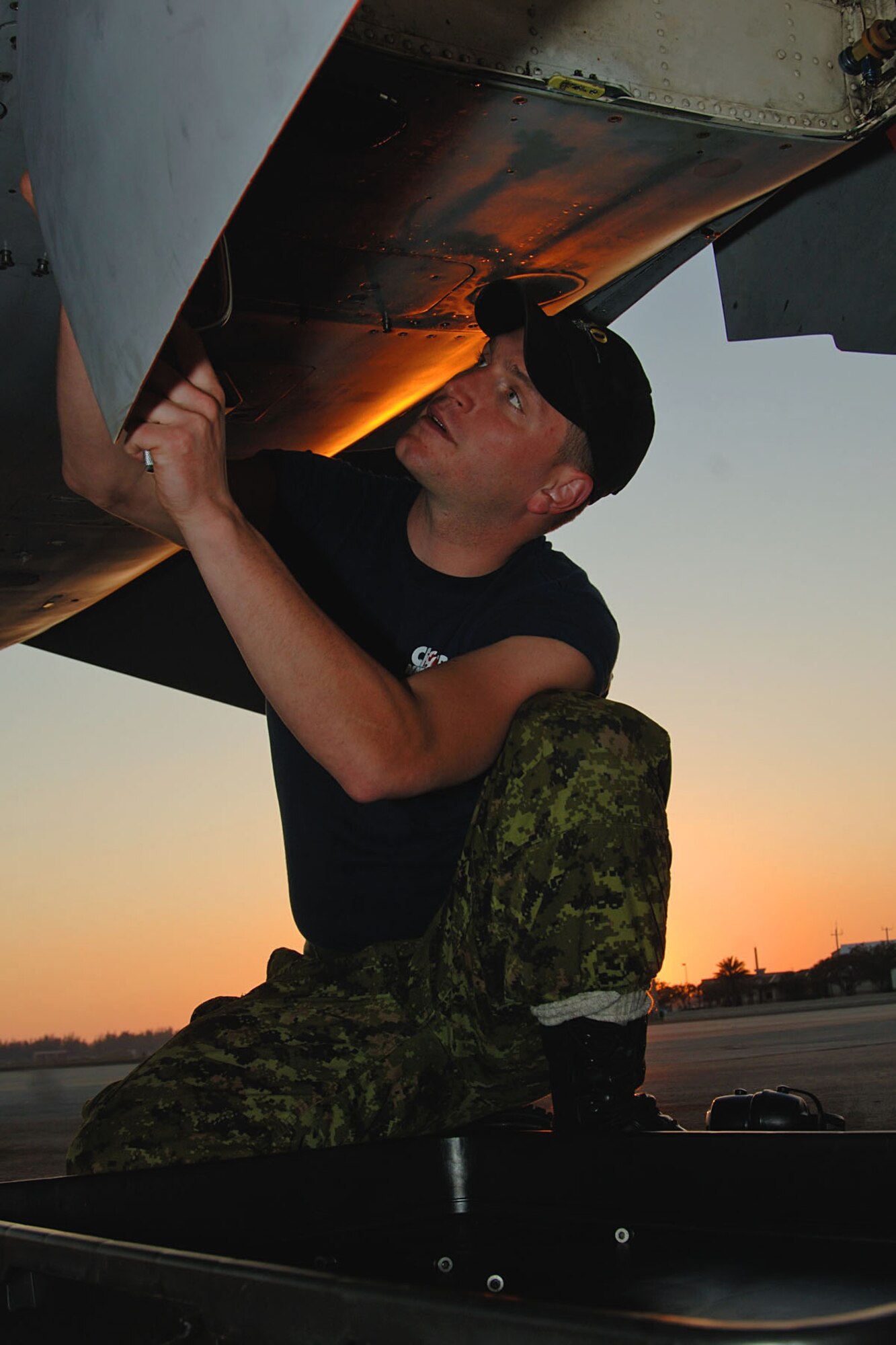 Corporal (Cpl) Marc-Andre Poirier from Sherbrooke, Quebec, checks a Canadian Forces CF-18 Feb. 22 during the bilateral exercise, CHUMEX, at Homestead Air Reserve Base, Fla. The three-week exercise pitted Canadian CF-18s against F-16s from Homestead’s 93rd Fighter Squadron. F-15s from the Florida Air National Guard also participated, and all of the fighters got support from an Airborne Warning and Control System aircraft from Tinker A.F.B, Okla. and a CC-130 refueling tanker from the Canadian Air Force. (Canadian Air Force photo/Cpl. J.A. Wilson)