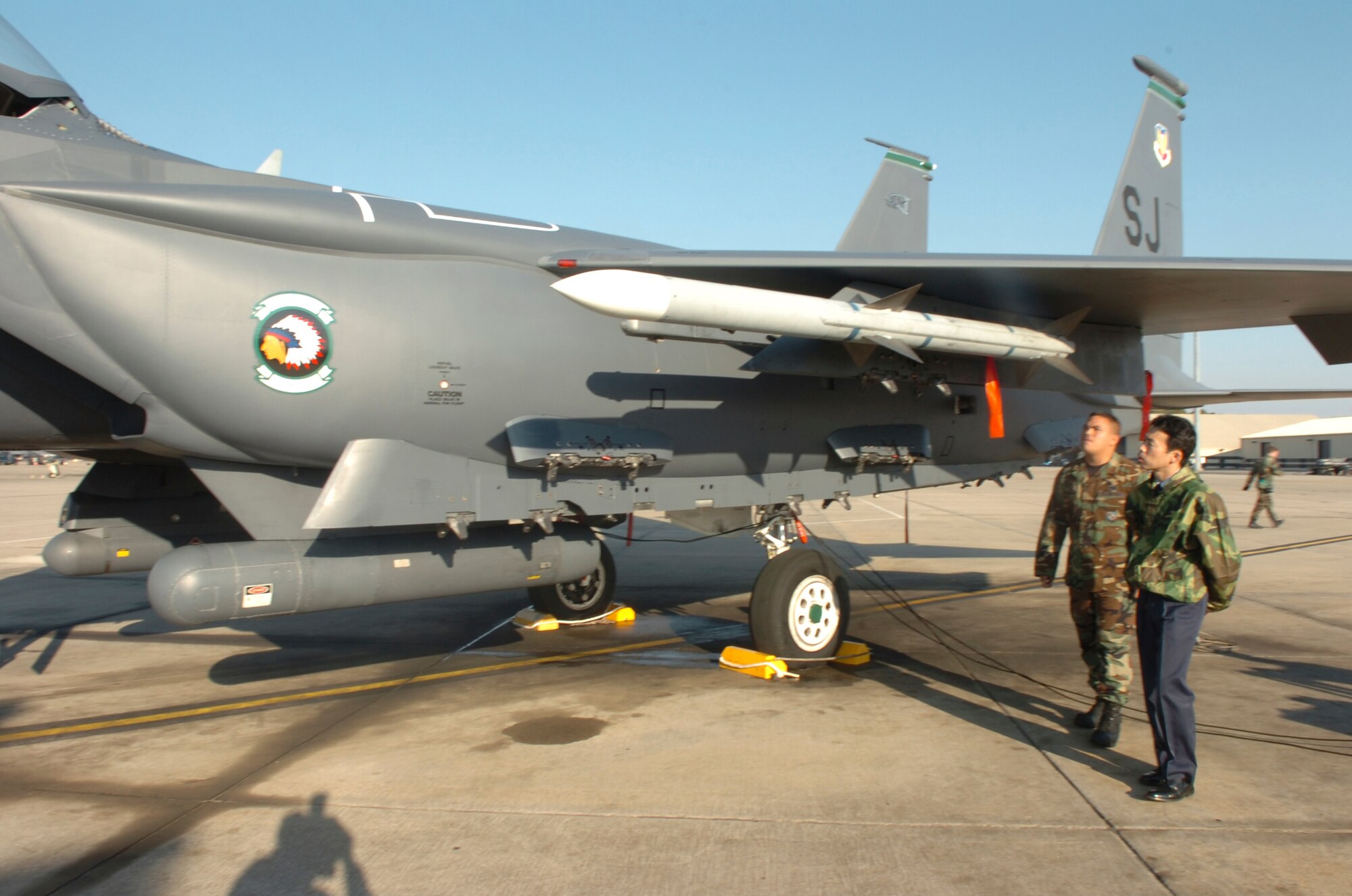 Tech. Sgt. Rickey Nolte gives Col. Toru Ota from the Japan Air Self Defense Force  a rundown on Seymour Johnson?s premier weapon, the F-15E Strike Eagle. Colonel Ota and his team visited the base to investigate possible replacements for the F-15J. (U.S. Air Force photo by Senior Airman Micky Bazaldua)