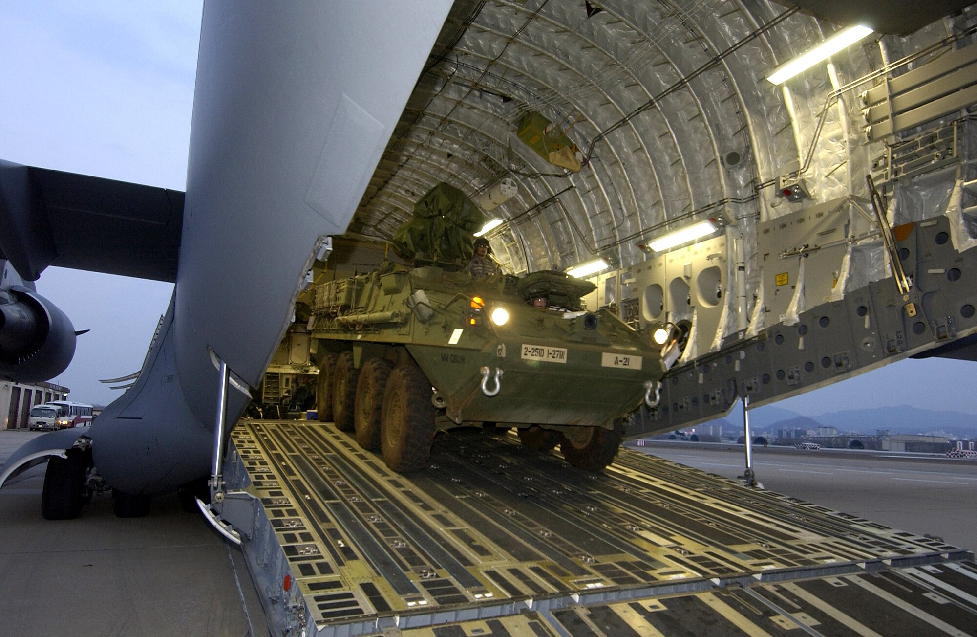 Soldiers from the 27th Infantry Division offload an M1126 Stryker infantry carrier vehicle from a C-17 Globemaster III March 18 in Daegu, South Korea, for Exercise Foal Eagle 2007.  The focus of the exercise is on strategic, operational and tactical aspects of general military operations in the Korean theater of operations.  Its intent is to demonstrate resolve to support the Republic of Korea against external aggression while improving ROK - U.S. combat readiness and joint and combined interoperability.  The C-17 is from the 15th Airlift Wing at Hickam Air Force Base, Hawaii. (U.S. Air Force photo/Master Sgt. Richard Freeland) 