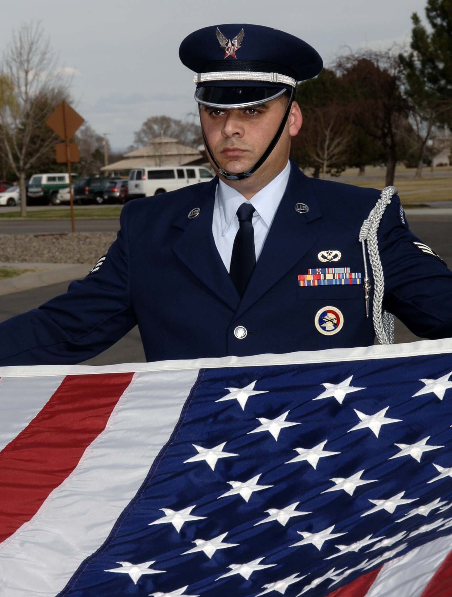 MOUNTAIN HOME AIR FORCE BASE, Idaho -- Senior Airman Dagoberto Ramirez from the base honor guard folds the flag during a retreat ceremony here March 19. Members of the 366th Mission Support Group stood in formation as part of the event. The base holds these formal retreats once a month from March to October with one of the wing's four groups responsible for conducting the formation each month. Air Force photo by Airman 1st Class Stephany Miller