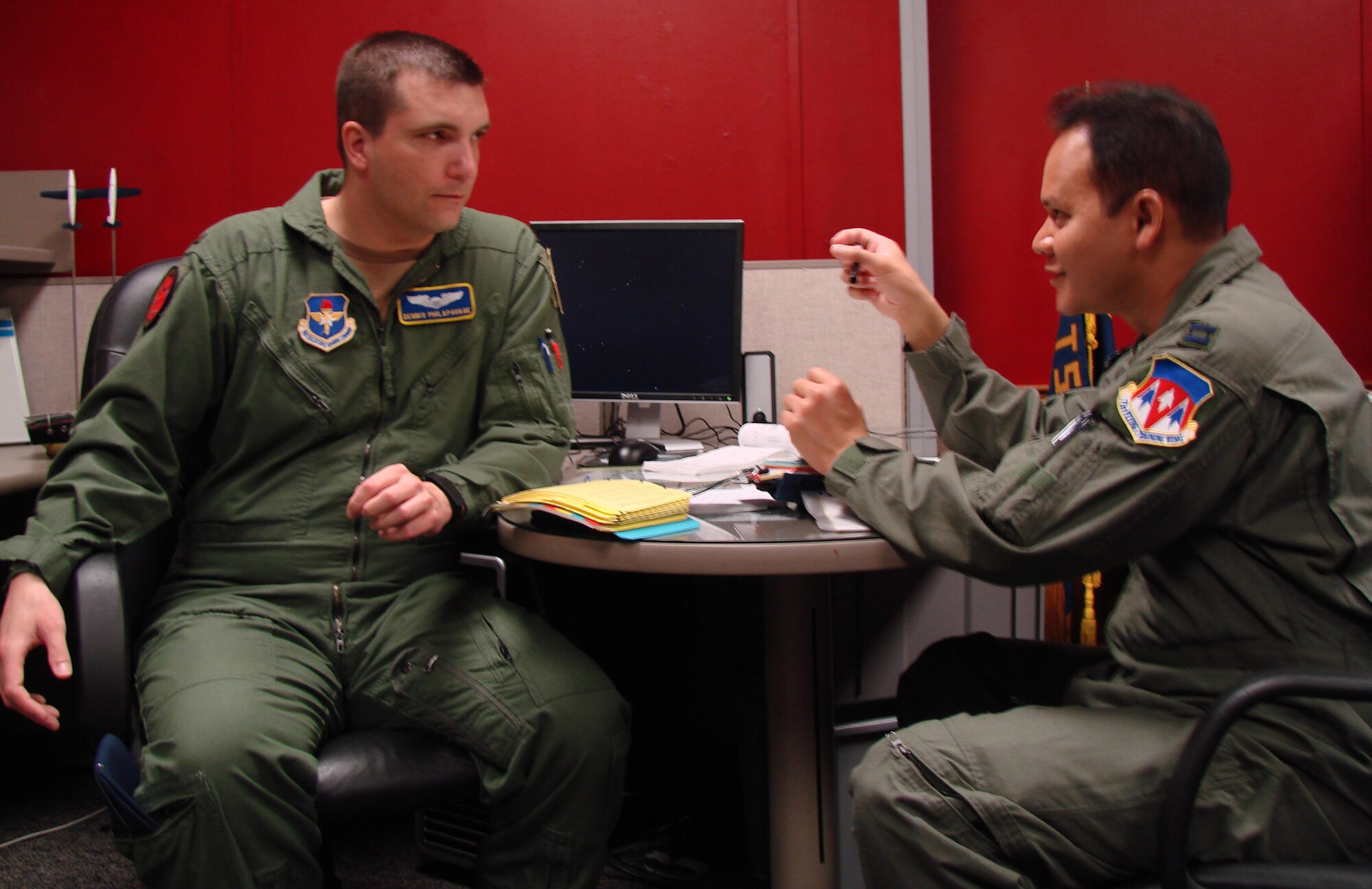VANCE AIR FORCE BASE, Okla. -- 2nd Lt. Dennis Philapavage, and Capt. Jared Sproat, 8th Flying Training Squadron, Fixed Wing Qualification students discuss flight procedures March 20.  (U.S. Air Force photo/Jennifer Carroll) 
 