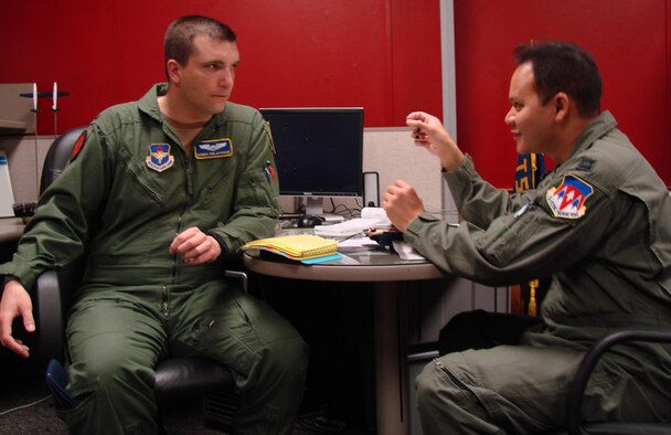 VANCE AIR FORCE BASE, Okla. -- 2nd Lt. Dennis Philapavage, and Capt. Jared Sproat, 8th Flying Training Squadron, Fixed Wing Qualification students discuss flight procedures March 20.  (U.S. Air Force photo/Jennifer Carroll) 
 