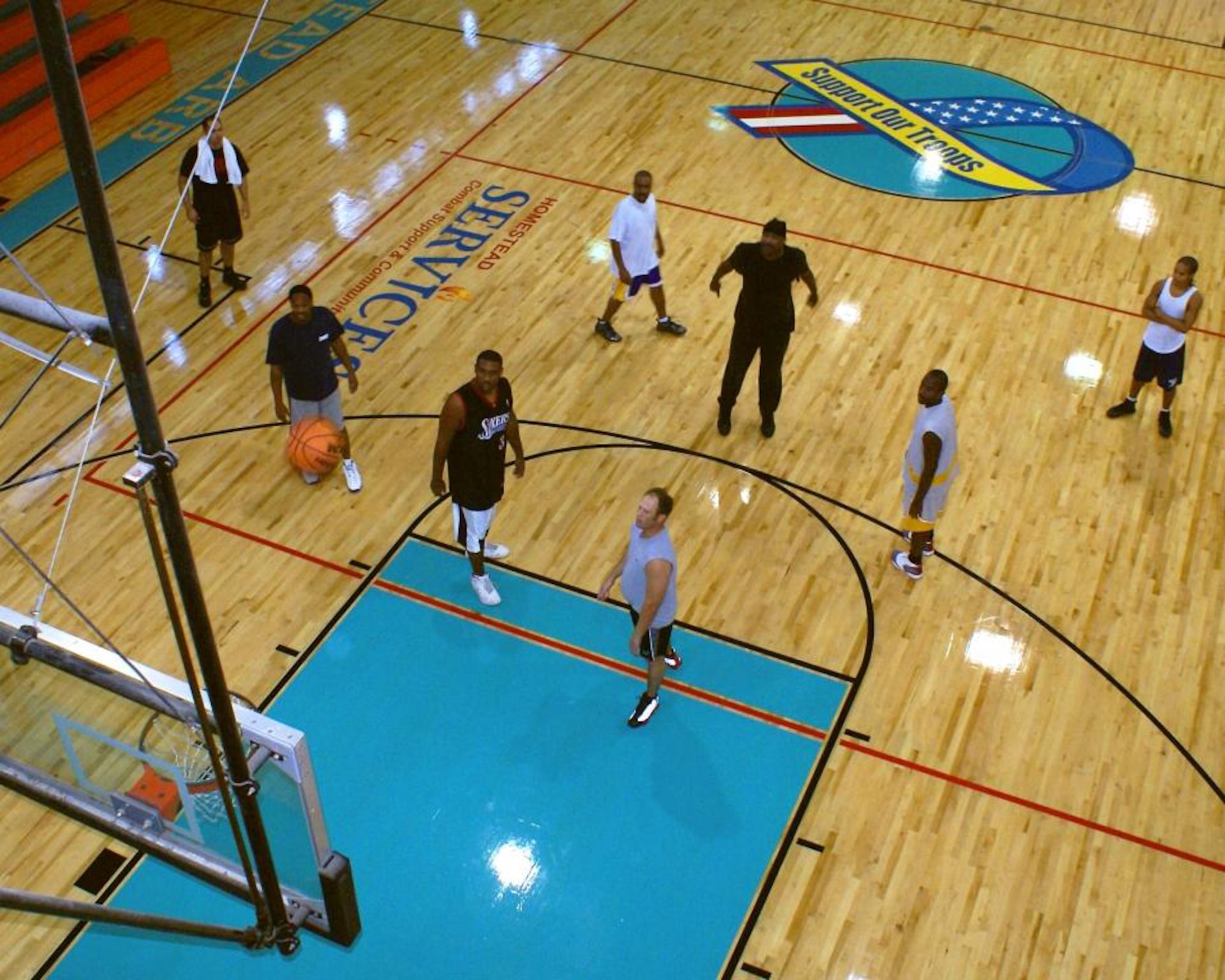 Visitors to the base fitness center can now take advantage of a newly replaced basketball court sporting new logos, including a “Support Our Troops” ribbon. Fitness center staff also added new equipment to the weight room and treadmills for the cardio room. (U.S. Air Force photo/Dan Galindo)
