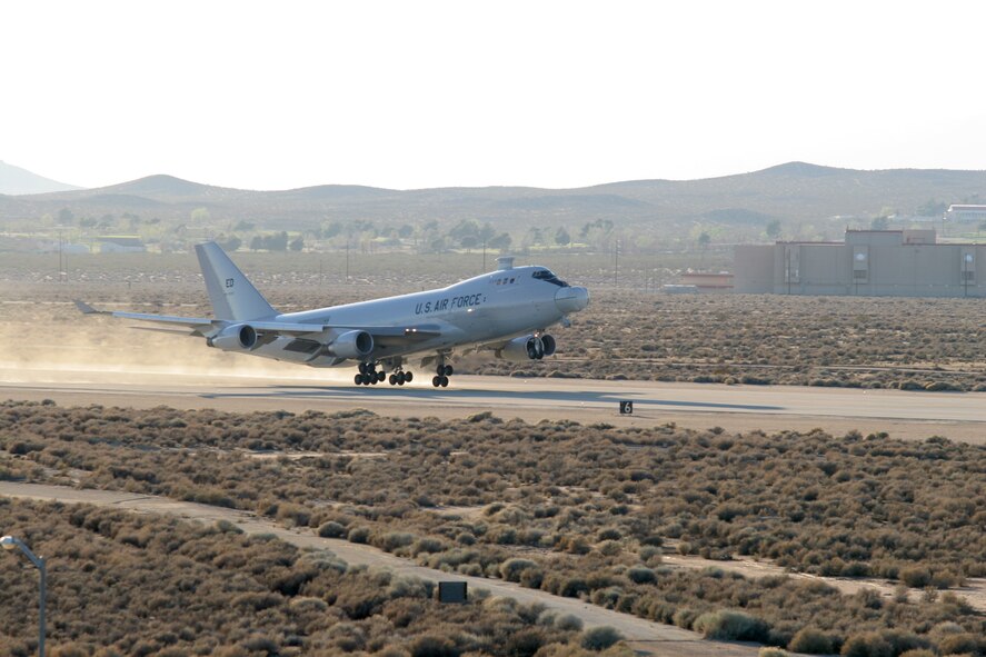 The YAL-1A, a modified Boeing 747-400F known as the Airborne Laser, takes off from Edwards Air Force Base, Calif., on March 15 for a five-hour test mission that would see the aircraft's Target Illuminator Laser fired in-flight for the first time. The Airborne Laser is undergoing a long-term test phase at the Air Force Flight Test Center here in preparation for the integration of the Chemical Oxygen Iodine Laser, or COIL -- a missile-killing, high-energy chemical laser, later in the year. (Photo by Kellie Masters)
