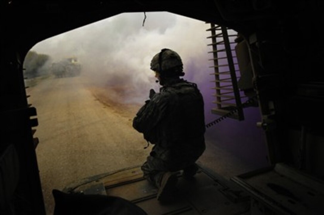 U.S. Army Staff Sgt. Kenneth Gunderson provides security for his fellow soldiers from the ramp of a Stryker combat vehicle in Buhriz, Iraq, on March 20, 2007.  Soldiers from 5th Battalion, 20th Infantry Regiment, 3rd Brigade Combat Team, 2nd Infantry Division, are conducting operations in the Diyala province.  