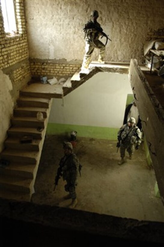 U.S. Army soldiers search a house in Jabbar, Iraq, during a cordon and search mission on March 16, 2007.  The soldiers are attached to Charlie Company, 1st Battalion, 12th Cavalry Regiment deployed from Fort Hood, Texas.  