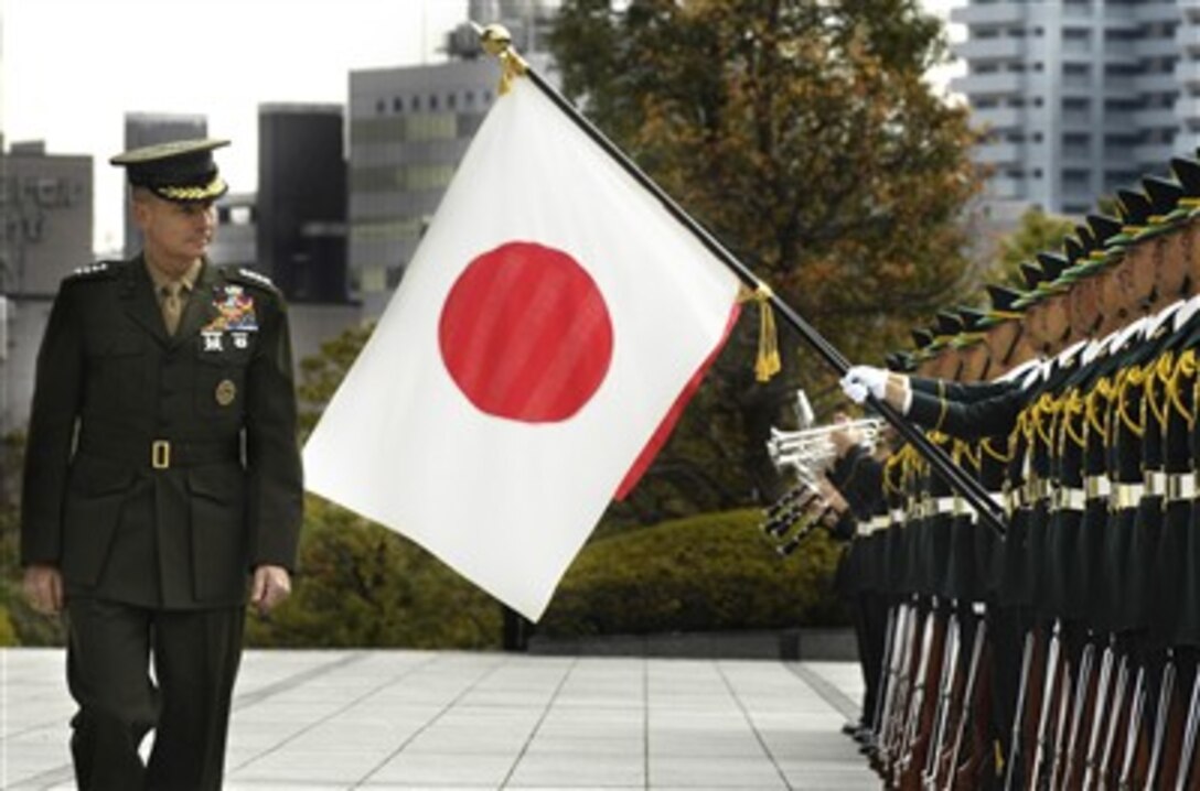 Chairman of the Joint Chiefs of Staff Gen. Peter Pace, U.S. Marine Corps, reviews ranks of Japanese soldiers as he arrives for a visit to the Japanese Ministry of Defense in Tokyo, Japan, on March 21, 2007.  