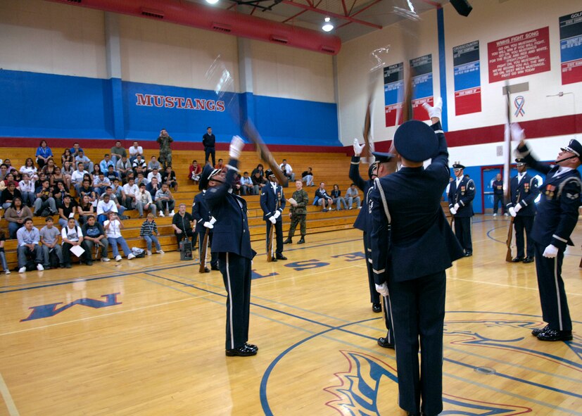 The United States Air Force Honor Guard Drill Team performs at West Mesa High School, Albuquerque, N.M., March 16, 2007. The Drill Team is the traveling component of the Air Force Honor Guard and tours Air Force bases world wide showcasing the precision of today's Air Force to recruit, retain, and inspire Airmen for the Air Force mission. (U.S. Air Force photo by Airman 1st Class Rusti Caraker)(Released)