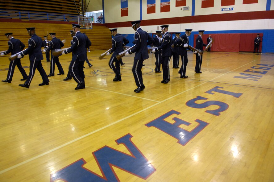 The United States Air Force Honor Guard Drill Team performs at West Mesa High School, Albuquerque, N.M., March 16, 2007. The Drill Team is the traveling component of the Air Force Honor Guard and tours Air Force bases world wide showcasing the precision of today's Air Force to recruit, retain, and inspire Airmen for the Air Force mission. (U.S. Air Force photo by Airman 1st Class Rusti Caraker)(Released)