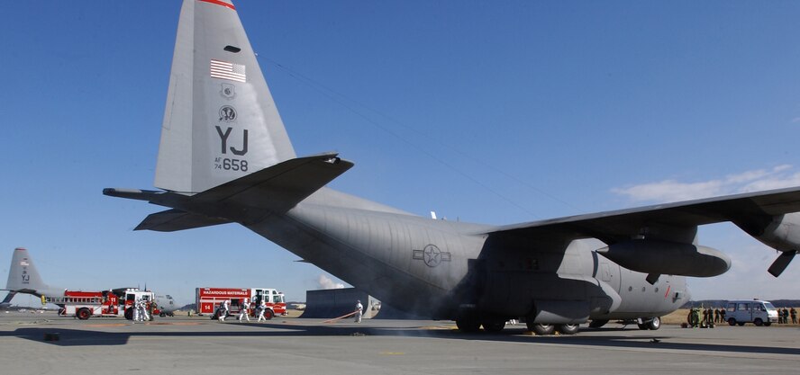 YOKOTA AIR BASE, Japan -- The Yokota Air Base Fire Department responds to a simulated explosion on the flightline during the Initial Response Readiness Inspection here, March 5 through 9. (U.S. Air Force photo by Airman Jonathan Fowler)                           