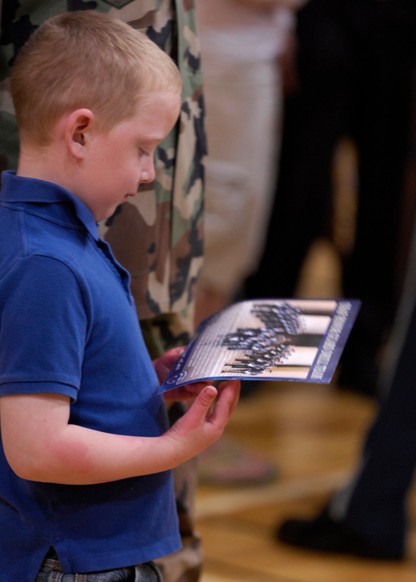 Hunter Horton, son of First Lt. Heath Horton , 377th Mission Support Group, receives autographs from the United States Air Force Honor Guard Drill Team after they perform at the West Fitness Center on Kirtland Air Force Base, N.M., March 15, 2007. The Drill Team is the traveling component of the Air Force Honor Guard and tours Air Force bases world wide showcasing the precision of today's Air Force to recruit, retain, and inspire Airmen for the Air Force mission. (U.S. Air Force photo by Airman 1st Class Rusti Caraker)(Released)