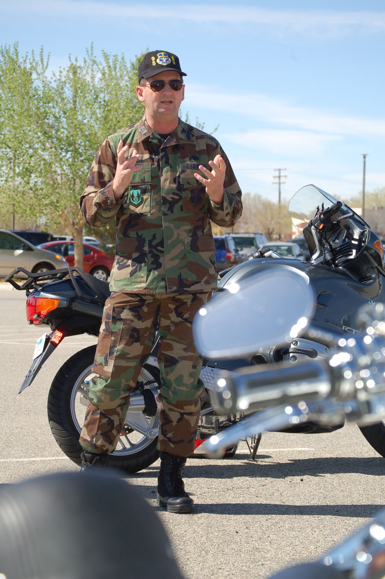 Col. H. Brent Baker Sr., 95th Air Base Wing commander, gives a motorcycle safety briefing to members of the Green Knights motorcycle club, prior to their participation in the Hypercycle Track Day ride to Willow Springs, Calif., March 19. (Photo by Airman Mikeal Young)