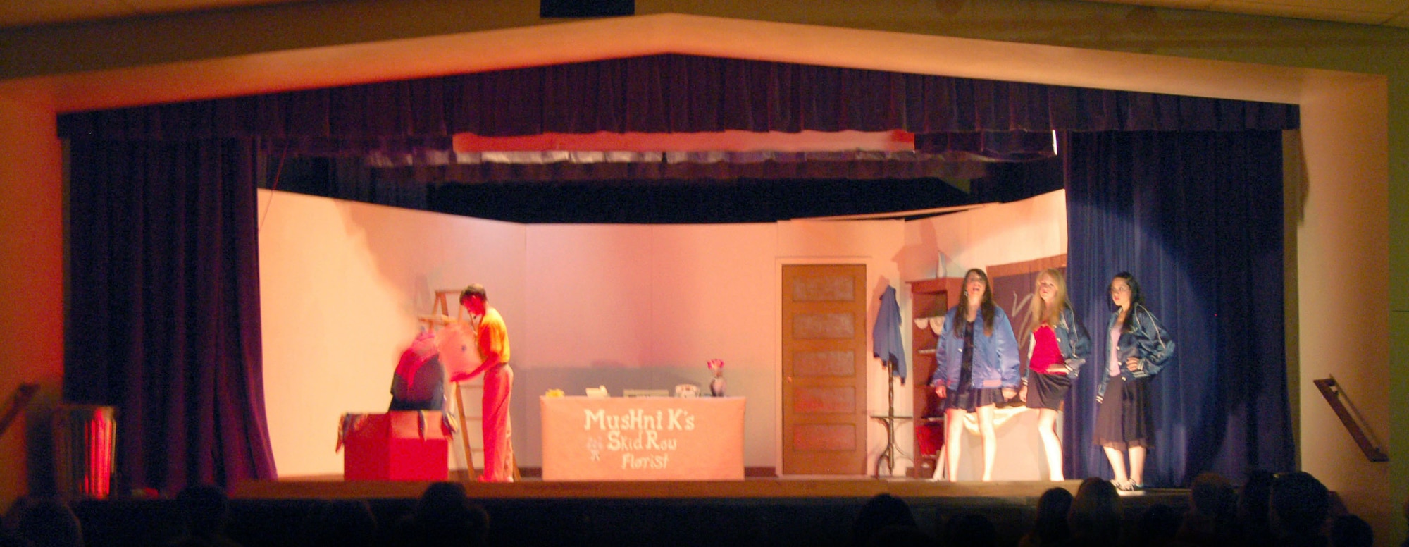 The Desert High School Drama Club performs at the DHS Scorpitorium stage during the premiere night of "Little Shop of Horrors" on March 16. Students from DHS, Edwards Middle School and Branch Elementary School participated in the production. (Photo by Airman 1st Class Julius Delos Reyes) 