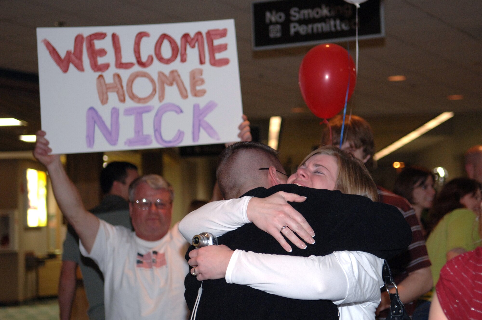 Staff Sgt. Nick Shatek is greeted by his sister Jill Petersen and family at Rapid City Regional Airport March 21. Sergeant Shatek, assigned to the 28th Security Forces Squadron, returned from a deployment to Southwest Asia in support of operations Iraqi Freedom and Enduring Freedom. (U.S. Air Force photo/Airman 1st Class Angela Ruiz) 
