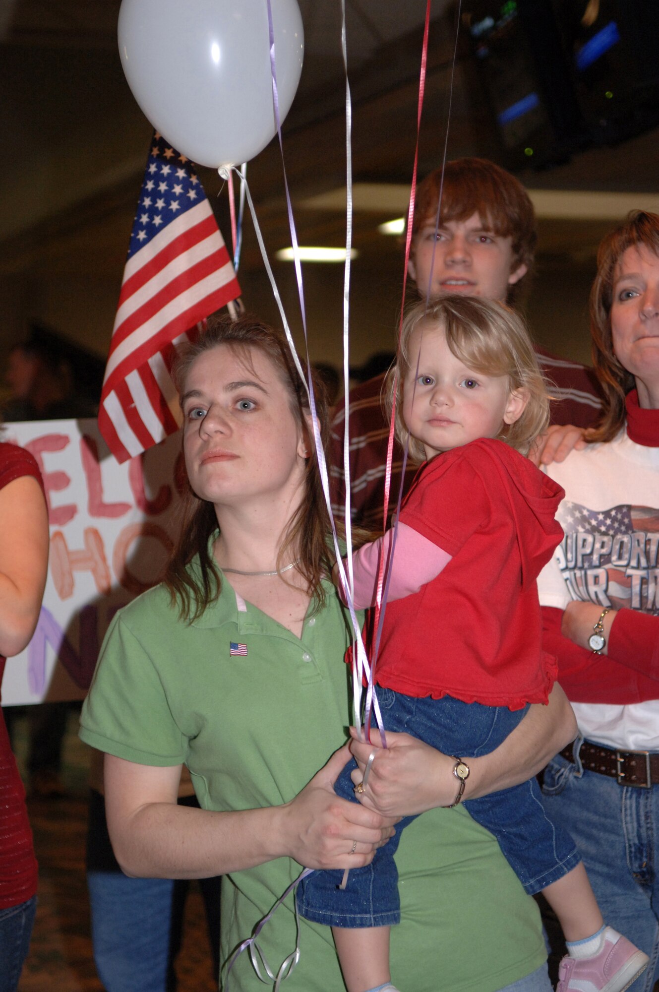 Gretta Hackman and family wait anxiously for the return of their loved one at Rapid City Regional Airport March 21. Airmen from the 28th Security Forces Squadron at Ellsworth Air Force Base, S.D., returned from a deployment to Southwest Asia in support of operations Iraqi Freedom and Enduring Freedom. (U.S. Air Force photo/Airman 1st Class Angela Ruiz)