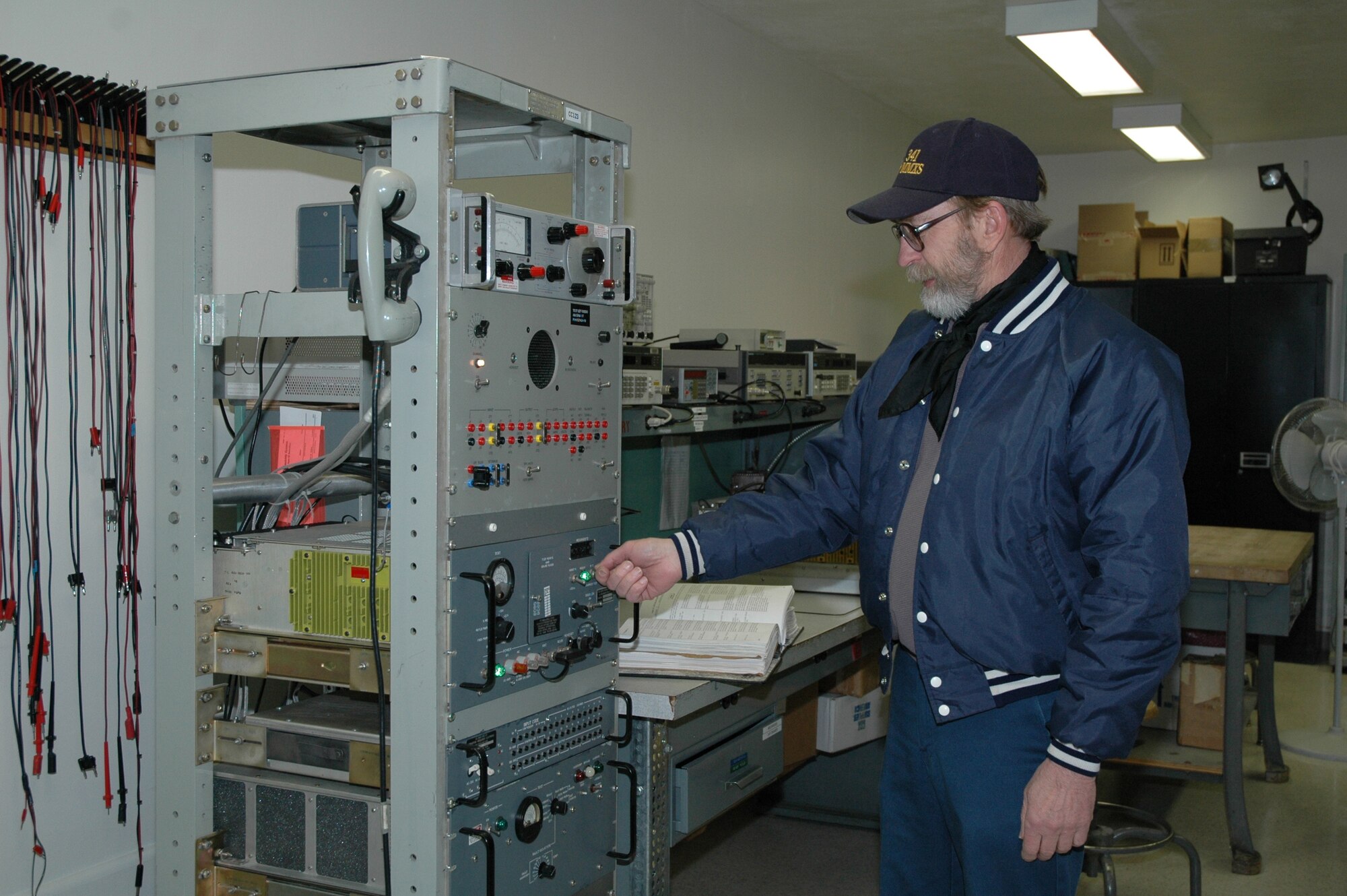 Gerald Snodgrass, the missile radio trainer for the 341st Missile Maintenance Squadron, prepares some equipment before starting a training class. Both won Air Force Space Command individual Communications and Information Annual Awards for 2006.