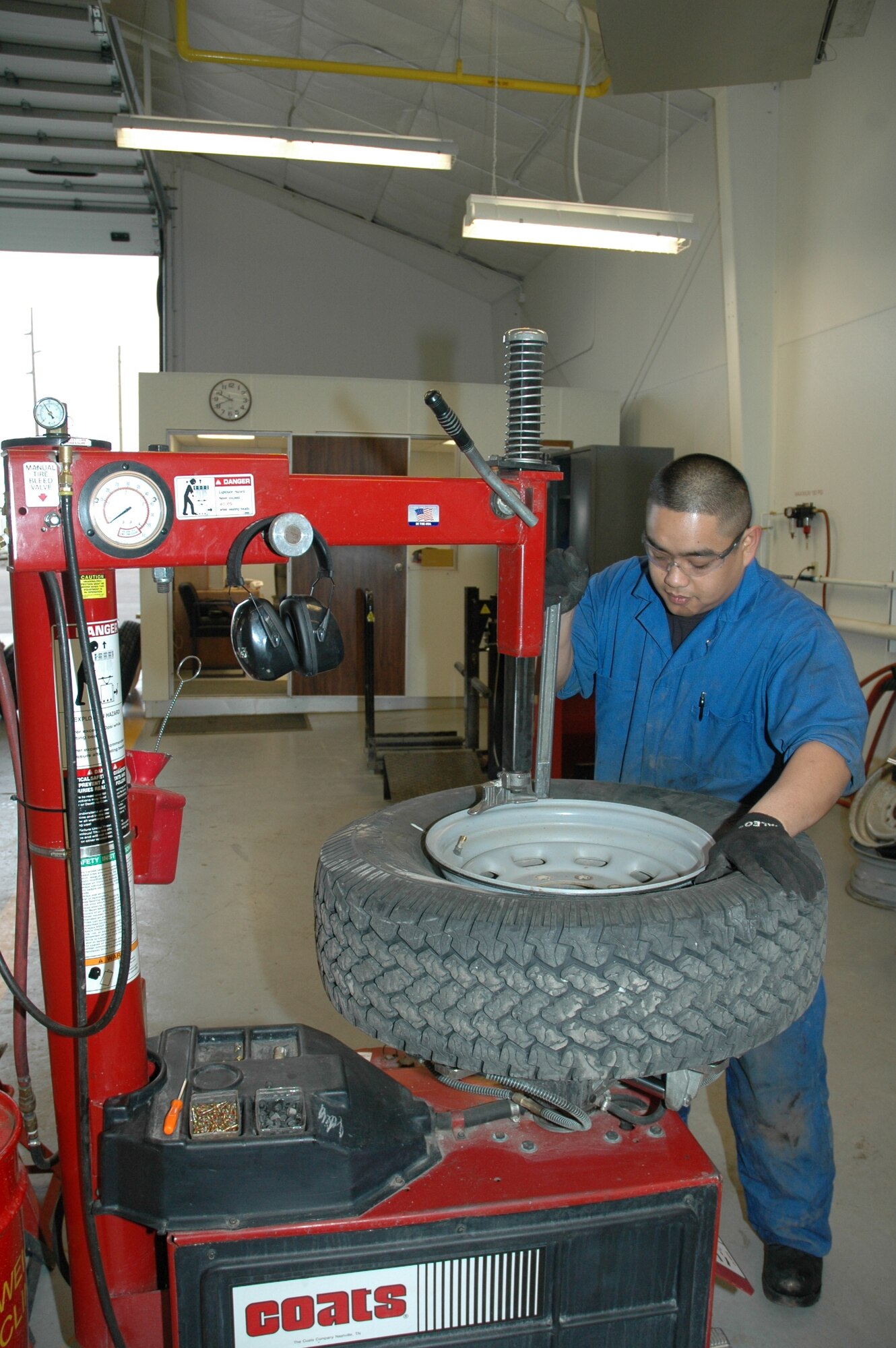 Airman 1st Class Daryl Bascom disbands and repairs a tire. The members of the 341st Logistics Readiness Squadron’s vehicle maintenance shop are responsible for the upkeep of 800 government vehicles at Malmstrom. For more coverage, see pages 10-11.