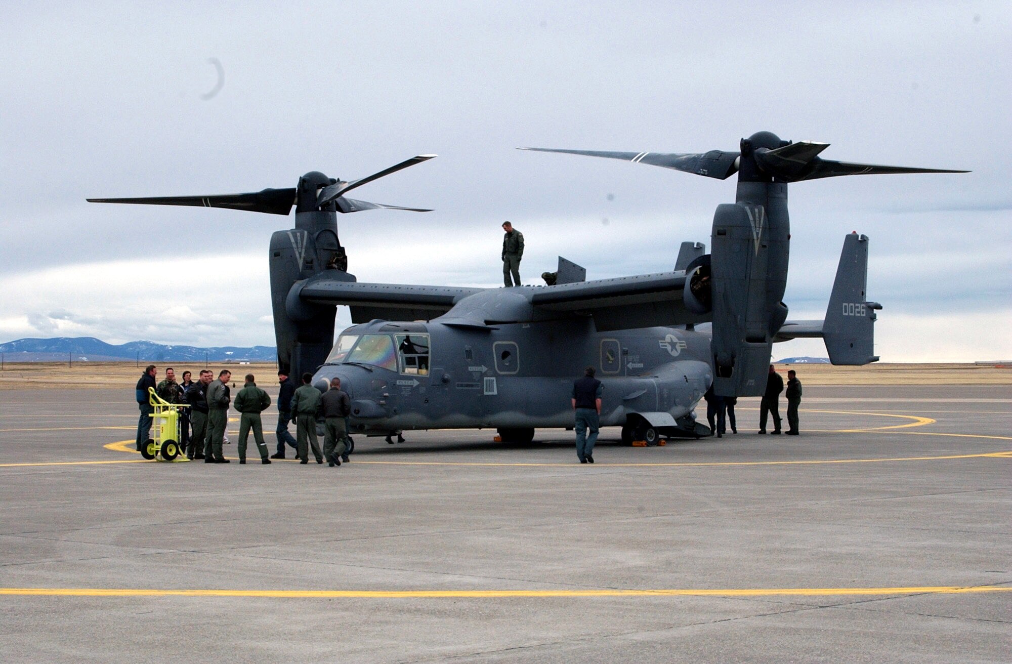 Crew members from the 40th Helicopter Squadron and Doss Aviation take an up-close look at the Osprey. The CV-22 is a tiltrotor aircraft that combines the vertical takeoff, hover, and vertical landing qualities of a helicopter with the long-range, fuel efficiency and speed characteristics of a turboprop aircraft.