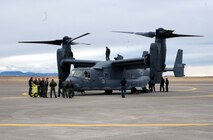 Crew members from the 40th Helicopter Squadron and Doss Aviation take an up-close look at the Osprey. The CV-22 is a tiltrotor aircraft that combines the vertical takeoff, hover, and vertical landing qualities of a helicopter with the long-range, fuel efficiency and speed characteristics of a turboprop aircraft.
