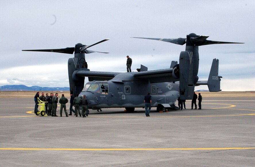 Crew members from the 40th Helicopter Squadron and Doss Aviation take an up-close look at the Osprey. The CV-22 is a tiltrotor aircraft that combines the vertical takeoff, hover, and vertical landing qualities of a helicopter with the long-range, fuel efficiency and speed characteristics of a turboprop aircraft.