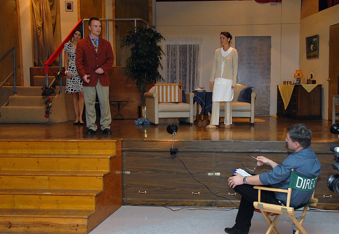 German Air Force Capt. Claas Bößer, an instructor pilot with the 89th Flying Training Squadron discuses a plot point with Col. Jeffery Kendall, 80th Flying Training Wing commander, during the opening night of the ENJJPT Players play, "Noises Off." (U.S. Air Force photo/Mike Litteken)
