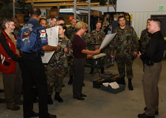 EIELSON AIR FORCE BASE, Alaska -- Tech. Sgt. Christopher Stone, 354th Security Forces Squadron, talks to Senior Leadership and Commanders for Mission Support Group Standup about crime scene investigation on March 21. Following the business-as-usual staff meetings, the attendees are given tours and briefed by Airmen and Non-Commissioned Officers on specific operations. (U.S. Air Force Photo by Airman 1st Class Jonathan Snyder)