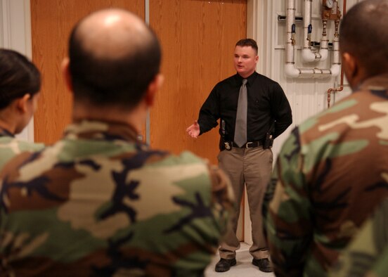 EIELSON AIR FORCE BASE, Alaska -- Tech. Sgt. Christopher Stone, 354th Security Forces Squadron, talks to Senior Leadership and Commanders for Mission Support Group Standup about crime scene investigation on March 21. Following the business-as-usual staff meetings, the attendees are given tours and briefed by Airmen and Non-Commissioned Officers on specific operations. (U.S. Air Force Photo by Airman 1st Class Jonathan Snyder)