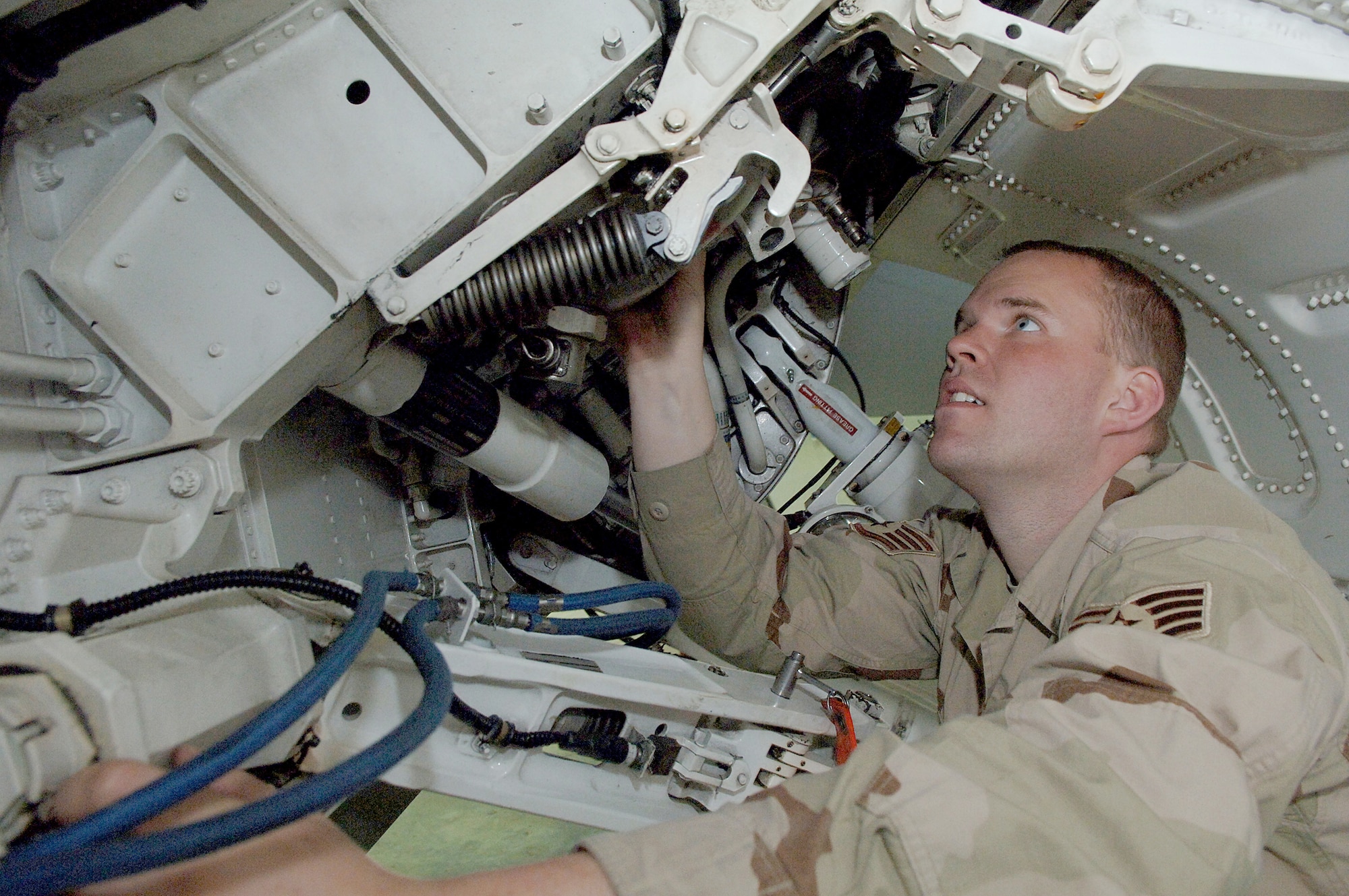 BALAD AIR BASE, Iraq -- Staff Sgt. Trever Vanderburg, an electrical and engineering specialist with the 332nd Expeditionary Aircraft Maintenance Squadron here, inspects a component on an F-16. He deployed here with the 148th Fighter Wing, Duluth Air National Guard Base, Minn. Of the more than 250 Duluth Guardsmen deployed here to the 332nd Air Expeditionary Wing's 'Tuskegee Airmen,' 41 are related. (U.S. Air Force photo/Airman 1st Class Nathan Doza)
