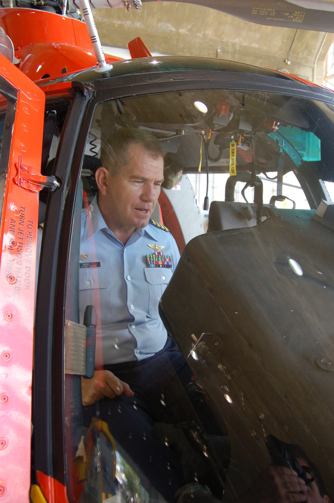 Coast Guard Capt. Thomas Wade checks the readiness of an HH-65C Dolphin helicopter March 20 at Coast Guard Air Station Borinquen, Puerto Rico. Captain Thomas is the commanding officer of the air station. The Coast Guard provides a search and rescue capability for 1.2 million square miles around the Caribbean. (U.S. Air Force photo/Tech. Sgt. Ben Gonzales) 