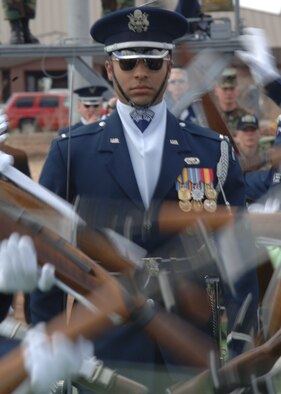 1st Lt. Joshua Hawkins, Air Force Honor Guard Drill Team officer in charge, walks through the gauntlet of spinning weapons in a sequence showing the trust the team has for every member. (U.S. Air Force photo by Airman 1st Class John Strong)