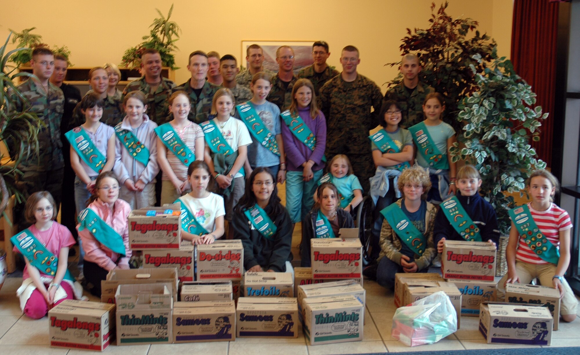 BUCKLEY AIR FORCE BASE, Colo. -- Local Girl Scouts from troop 679 donated close to 300 boxes of a variety of the popular cookies to the residents of Panther and Patriot Hall here March 21. The girls were recognizing their Hometown Heroes, which are the people and organizations that help make communities better places to live. Heroes include fire fighters, police, food banks, shelters and armed forces personnel stationed in United States and overseas. In 2006, the Girl Scouts in the Mile Hi Council donated more than 20,000 boxes of cookies to men and women serving in the armed forces. (U.S. Air Force photo by Staff Sgt. Sanjay Allen)