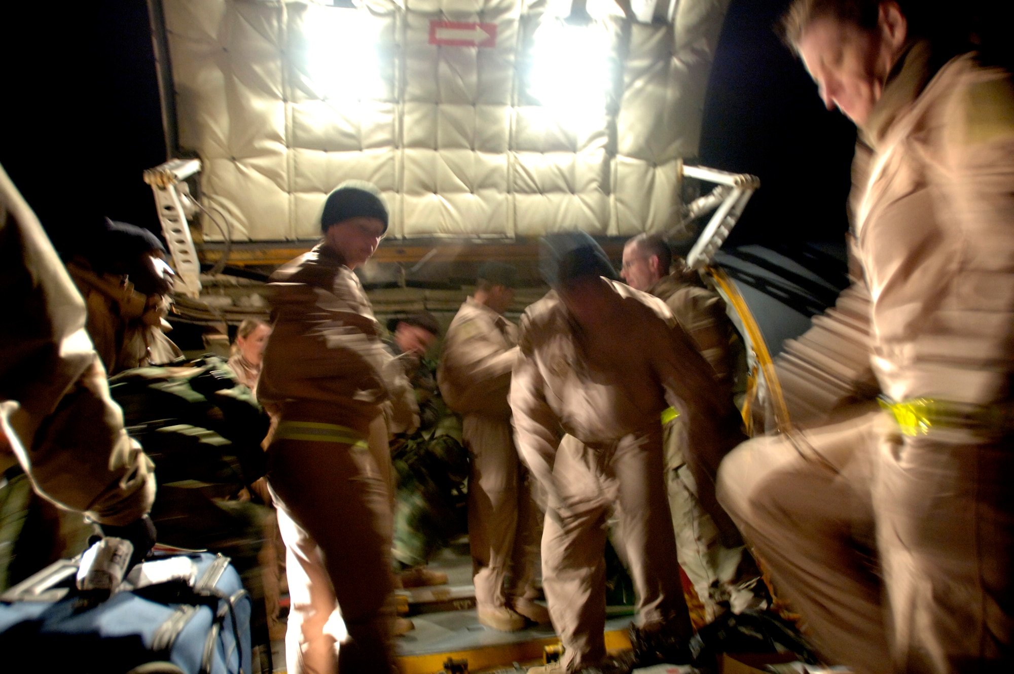 Air evacuation crew members load patients' gear onto an aircraft for the first non-stop medical evacuation flight from Bagram Air Base, Afghanistan to Landstuhl, Germany, 
March 21. The previous three- to five-day route from Bagram AB through Kuwait to Landstuhl has been reduced to an approximate 10-hour direct flight to provide faster service to wounded servicemembers and Department of Defense civilians. (U.S. Air Force photo/Tech. Sgt. Cecilio M. Ricardo Jr.)
