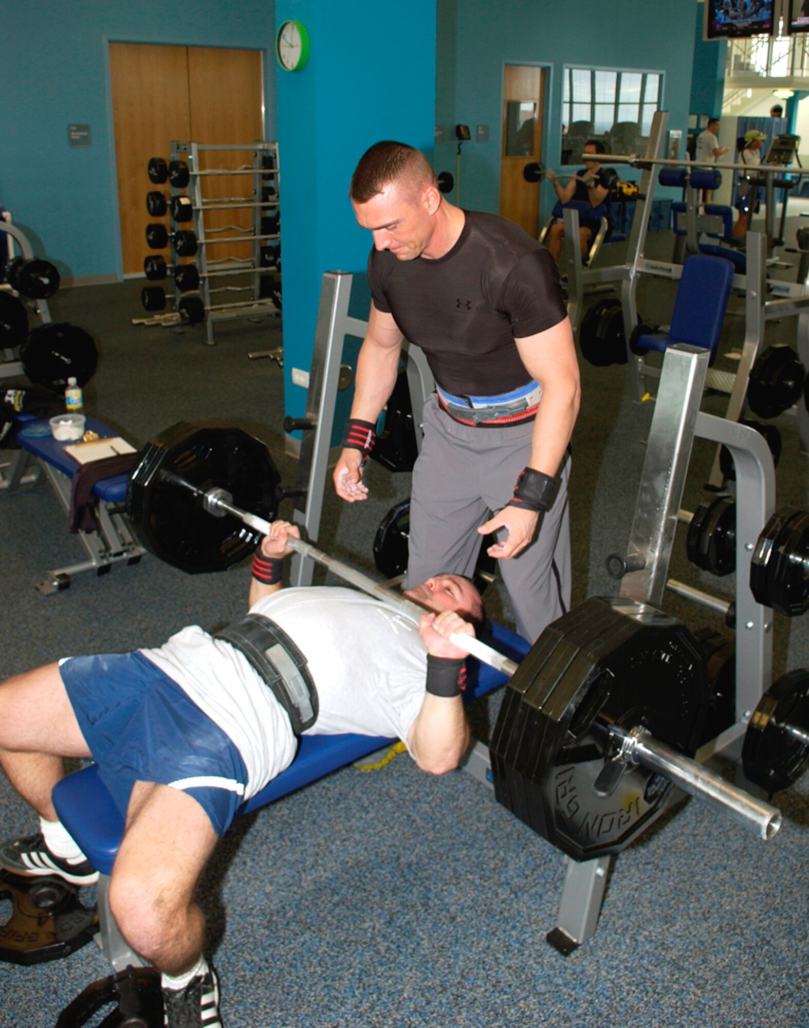 LAJES FIELD, Azores, Portugal -- Guy Dashnea, 65th Security Forces Squadron, spots Devin Marsh, 65th Medical Operations Squadron, in the Chace Fitness Center here March 14. Dashnea and Marsh will compete in the U.S. Air Forces In Europe's 2007 Powerlifting Competition in Bamberg, Germany, April 21. (U.S. Air Force photo by Senior Airman Taylor Marr) 