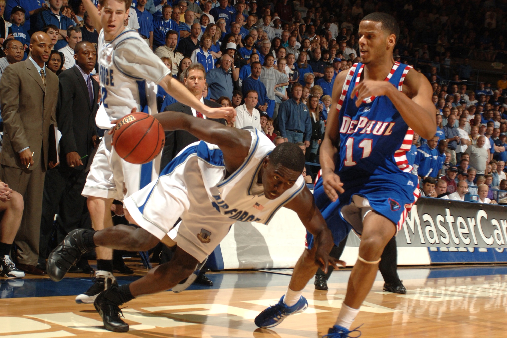 Falcon forward Dan Nwaelele eyes a path past DePaul's Sammy Mejia March 21 at Clune Arena. Nwaelele scored 10 points in Air Force's 52-51 win and a berth in the NIT semifinals in New York's Madison Square Garden March 27 against Clemson. (U.S. Air Force photo/Joel Strayer)