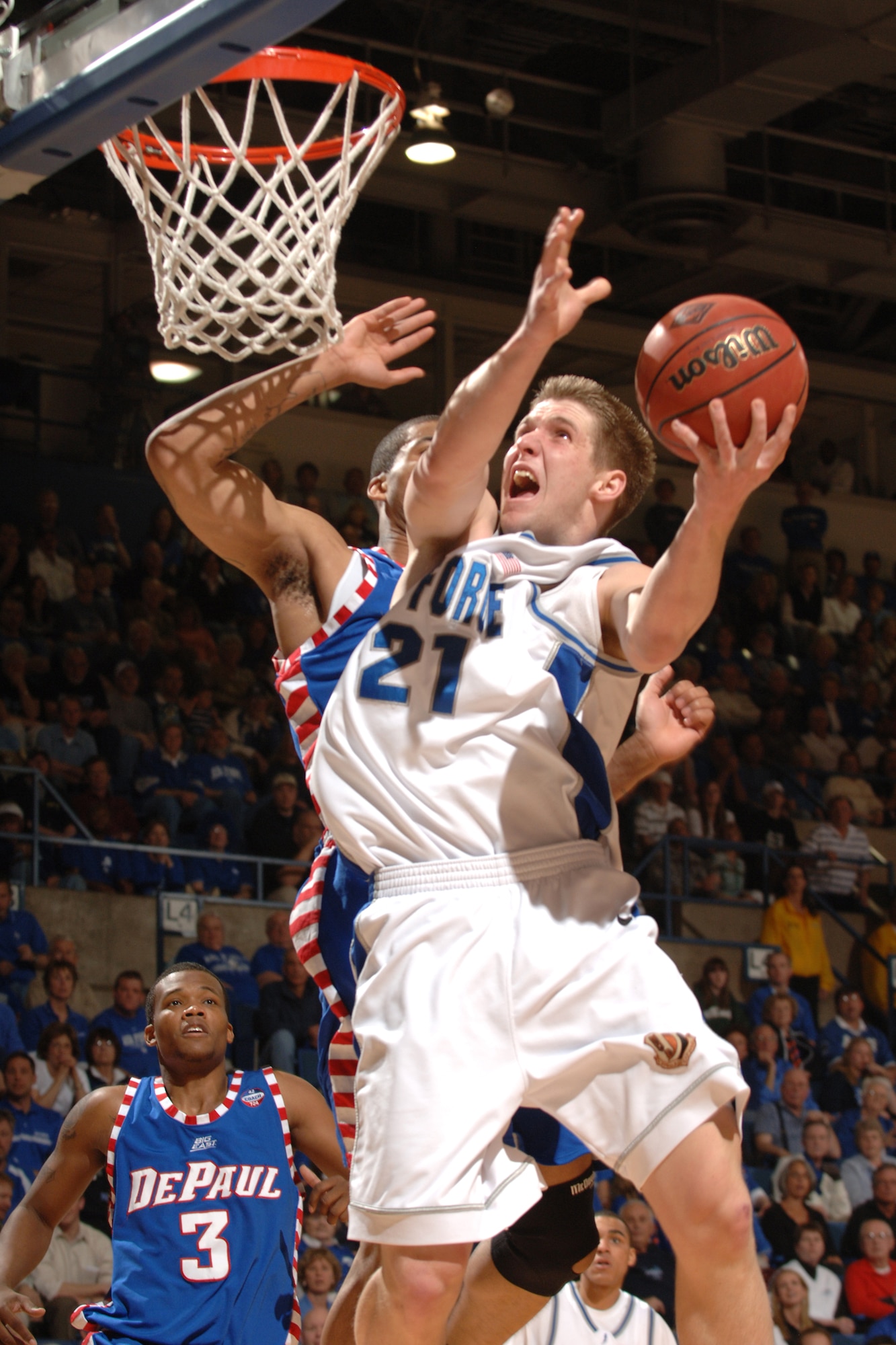 Falcon forward Jacob Burtschi drives against DePaul March 21 at Clune Arena. Burtschi's bucket with 7.7 seconds left gave Air Force a 52-51 win and a berth in the NIT semifinals in New York's Madison Square Garden March 27 against Clemson. (U.S. Air Force photo/Joel Strayer)