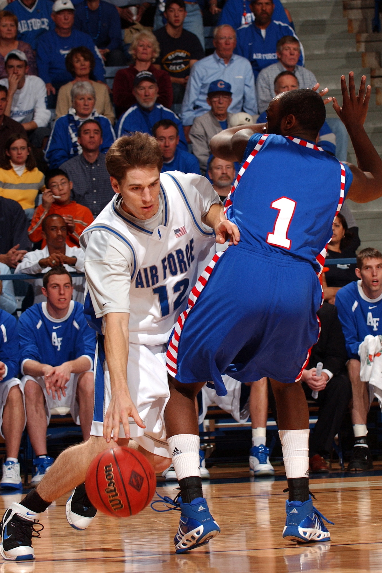 Falcon guard Tim Anderson looks for room past DePaul's Jabari Currie March 21 at Clune Arena. Anderson made two key steals in Air Force's 52-51 win for a berth in the NIT semifinals in New York City's Madison Square Garden March 27 against Clemson. (U.S. Air Force photo/Danny Meyer) 