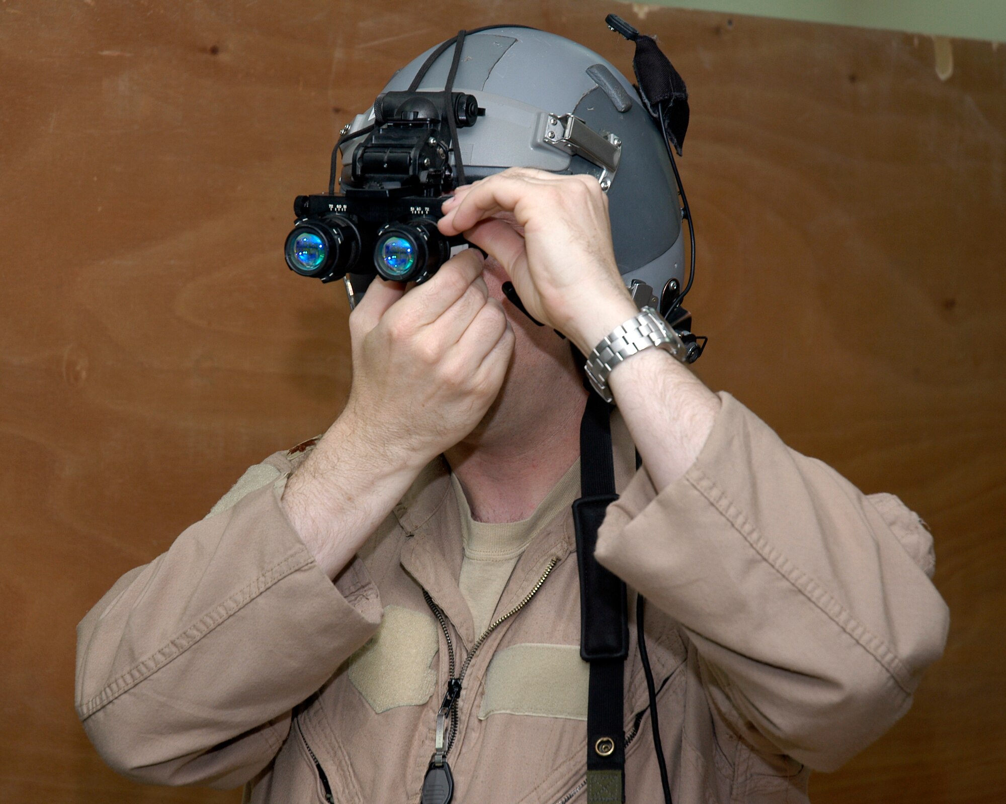 SOUTHWEST ASIA -- Maj. Jon Watson, a pilot with the 737th Expeditionary Airlift Squadron, tests his night vision goggles before departing on his 175th combat mission March 22, 2007. This mission will bring Major Watson over 1,000 combat hours in his career, a milestone for any pilot.                                 