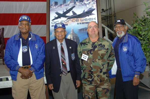 (Left to right) Atlanta Chapter Tuskegee Airmen--retired Chief Master Sgt. Don Summerlin, and World War II veterans Mr. Hiram Little and retired Master Sgt. Val Archer--converse with Tech. Sgt. Edward Fairchild, 717th Aircraft Maintenance Squadron crew chief.  Sergeant Fairchild and the Tuskegee Airmen were part of the Junior Reserve Officer Training Corps Week at Dobbins Air Reserve Base, Ga. More than 3,000 JROTC and Civil Air Patrol cadets were treated to C-130 orientation flights, aircraft displays and static displays, and interacted with Airmen in various career fields in celebration of the Air Force 60th Anniversary.  Mr. Archer was a featured speaker during the event. (U.S. Air Force Photo/ Master Sgt. Stan Coleman)

