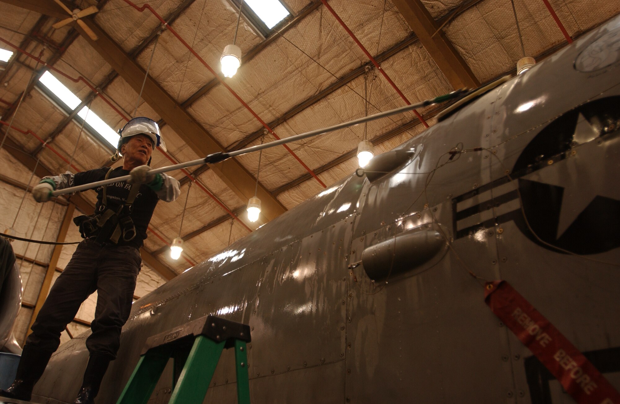 OSAN AIR BASE, Republic of Korea --  Mr. Yong U Sok, 51st Maintenance Squadron, washes an A-10 Thunderbolt March 16. Jets are washed every 90 days here to keep them from deteriorating. The amount of time that passes between washes is based on the environment where jets are stationed. For example, a jet that is stationed near sea water is washed more often than one that is in a dry climate. (U.S. Air Force photo by Airman Jason Epley)