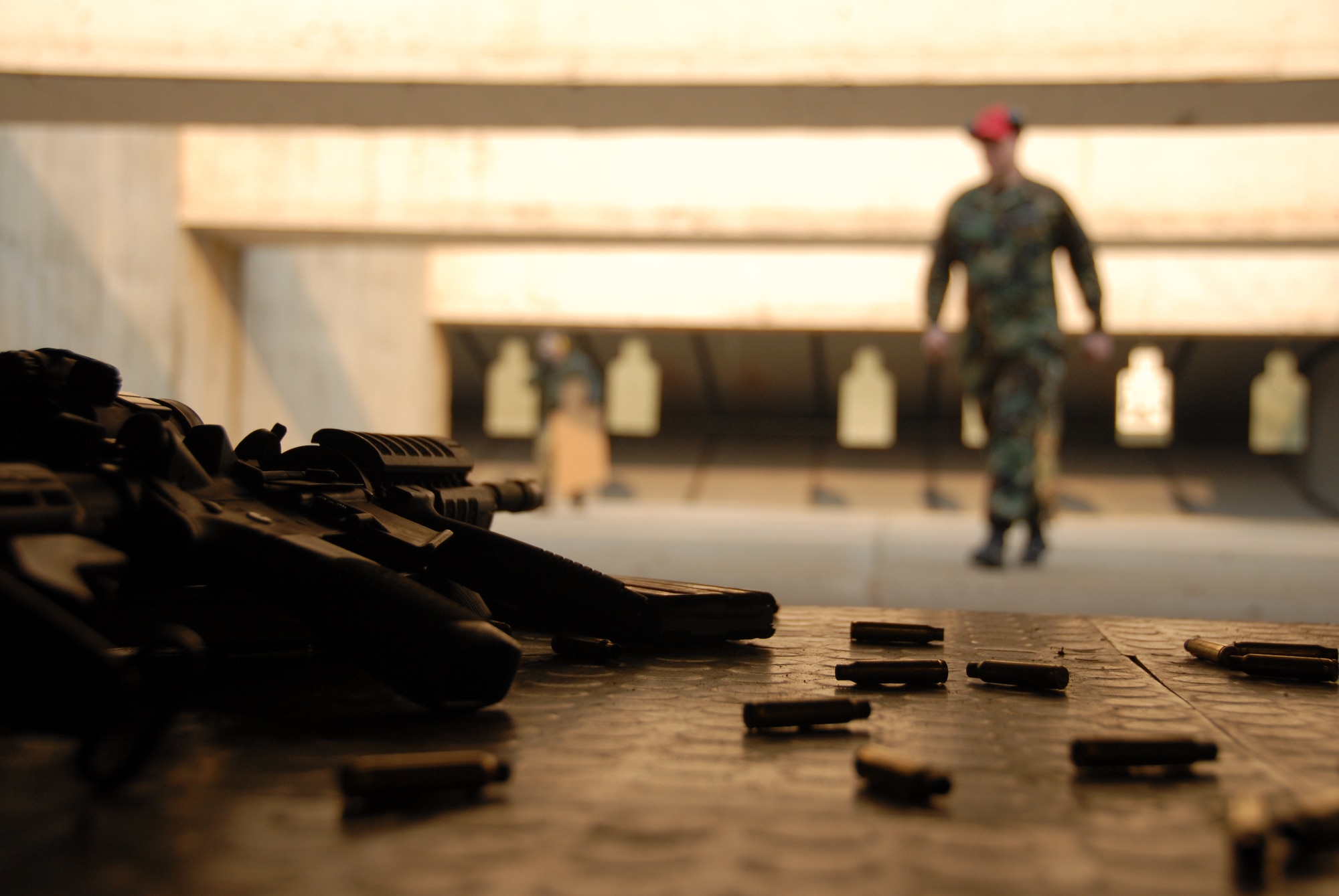 OSAN AIR BASE, Republic of Korea --  A rifle range instructor walks back to the shooting line after scoring the targets here March 15, 2007.  Annually going to the shooting range will better prepare you for a war environment.  (U.S. Air Force photo by Airman 1st Class Chad Strohmeyer)