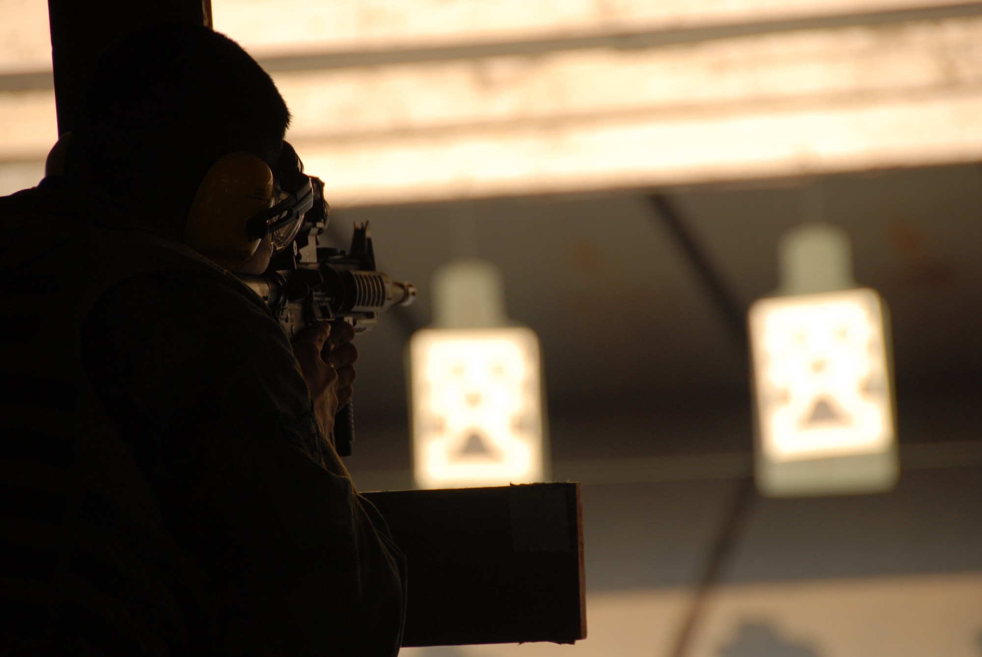 OSAN AIR BASE, Republic of Korea --  Airmen test their skills at the shooting range to see if they can achieve marksman March 15.  (U.S. Air Force photo by Airman 1st Class Chad Strohmeyer)