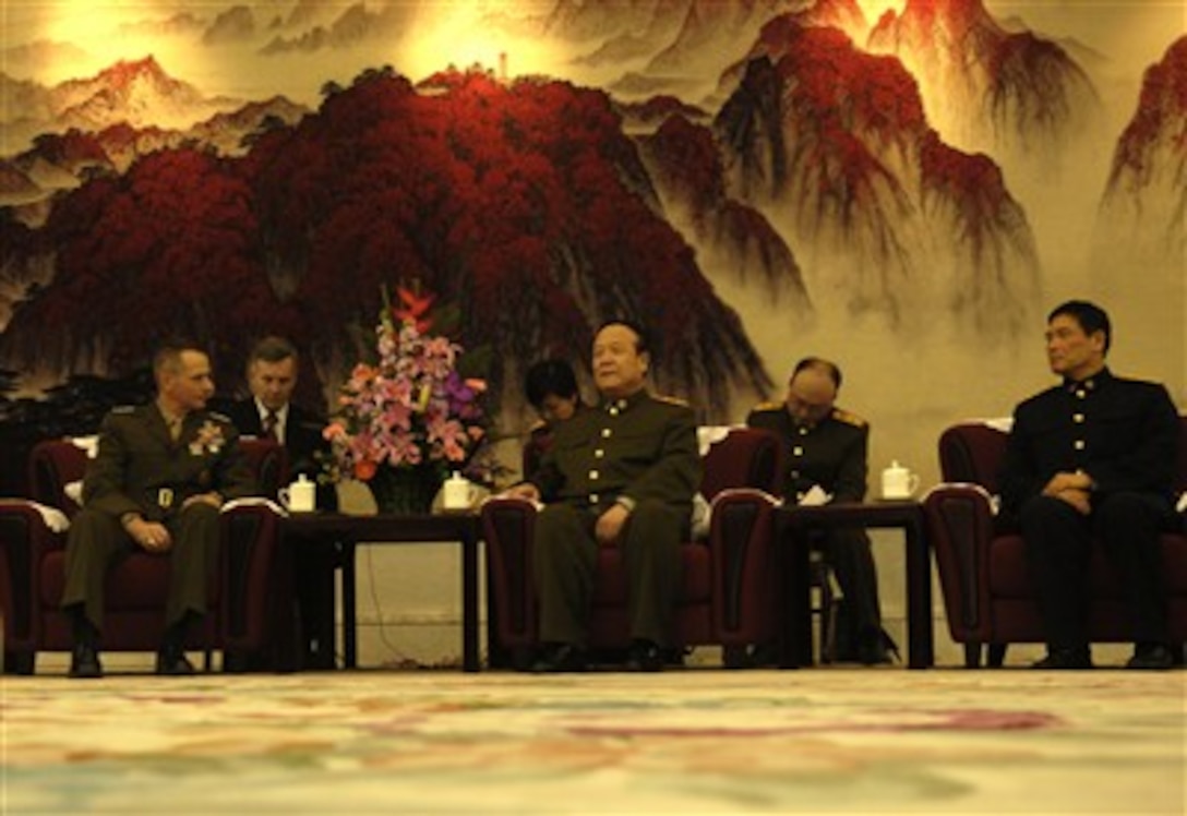 Chairman of the Joint Chiefs of Staff U.S. Marine Gen. Peter Pace and Chinese Gen. Guo Boxiong discuss ways to improve military-to-military relationships between their two nations at Beijing, March 22, 2007. 