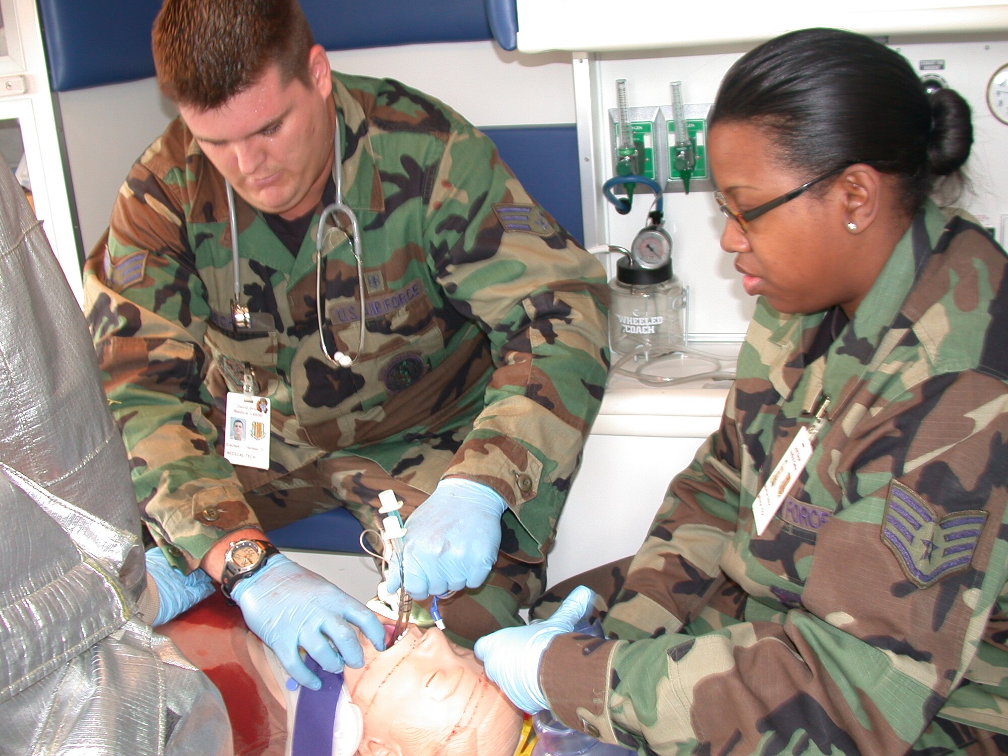 Senior Airman Nick Eischen, 60th Medical Operations Squadron emergency medical technician, inserts a Combitube artificial airway on an interactive and remotely controlled mannequin during a recent Joint Emergency-Fire Department Trauma Response Exercise at Travis. The objective of the exercise is to test the Emergency and Fire department’s trauma inter-agency response, communication and team performance in responding to a life-threatening emergency. (U.S. Air Force photo by Tech. Sgt. Austin Delacruz, 60th Medical Operations Squadron)