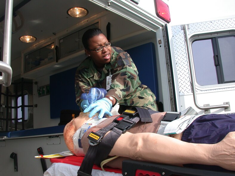 A 60th Medical Operations Squadron Emergency Department team member loads an interactive remotely controlled mannequin into an ambulance during a recent Joint Emergency-Fire Department Trauma Response Exercise at Travis. The medical emergency personnel and the Fire department worked together to improve inter-agency response, communication and team performance. (U.S. Air Force photo by Tech. Sgt. Austin Delacruz 60th, Medical Operations Squadron)

