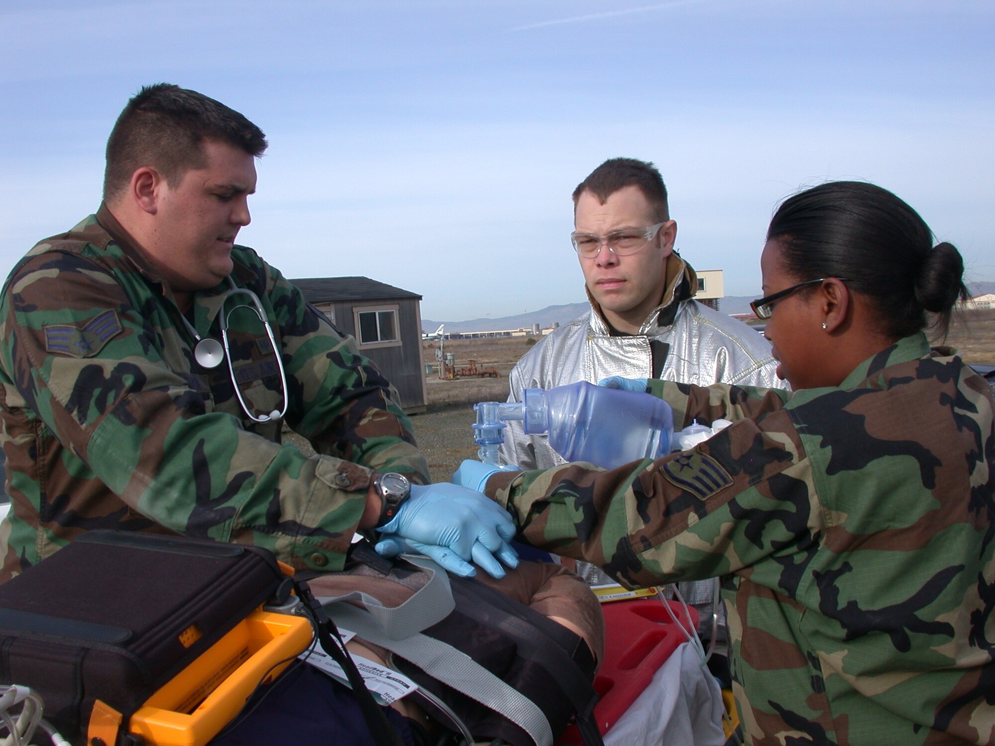 Senior Airman Nick Eischen, 60th Medical Operations Squadron Emergency Medical Technician, performs CPR on an interactive remotely controlled mannequin, during a recent Joint Emergency-Fire Department Trauma Response Exercise at Travis. The medical emergency personnel and the Fire department worked together to test their inter-agency response, communication and team performance. (U.S. Air Force photo by Tech. Sgt. Austin Delacruz, 60th Medical Operations Squadron)