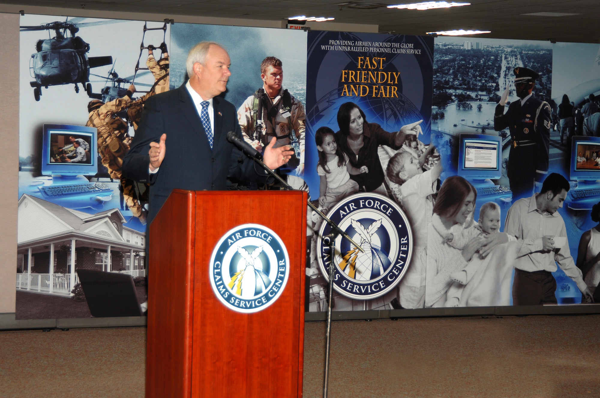 Secretary of the Air Force Michael Wynne addresses attendees at the dedication for the Air Force Claims Service Center on March 23 in Kettering, Ohio. The center centralizes processing and payment for all personal property claims previously filed at base legal offices worldwide.  Airmen and civilian employees can now file loss or damage claims any time on-line, with live assistance available 24/7 toll-free.  Air Force photo by Ben Strasser.